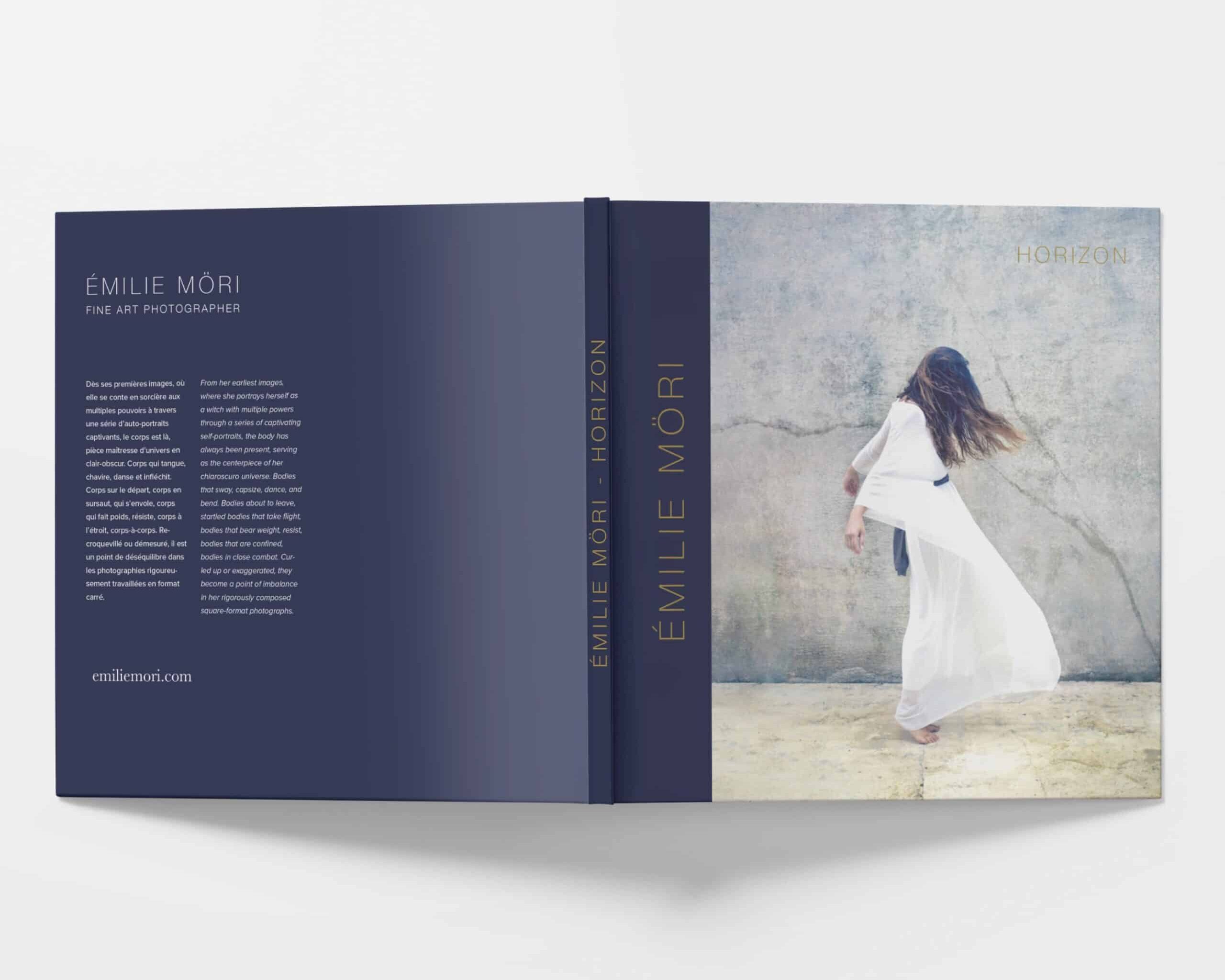 Front and back cover of Emilie Möri's new photo book, "Horizon" laying open on a white surface with the cover facing up.