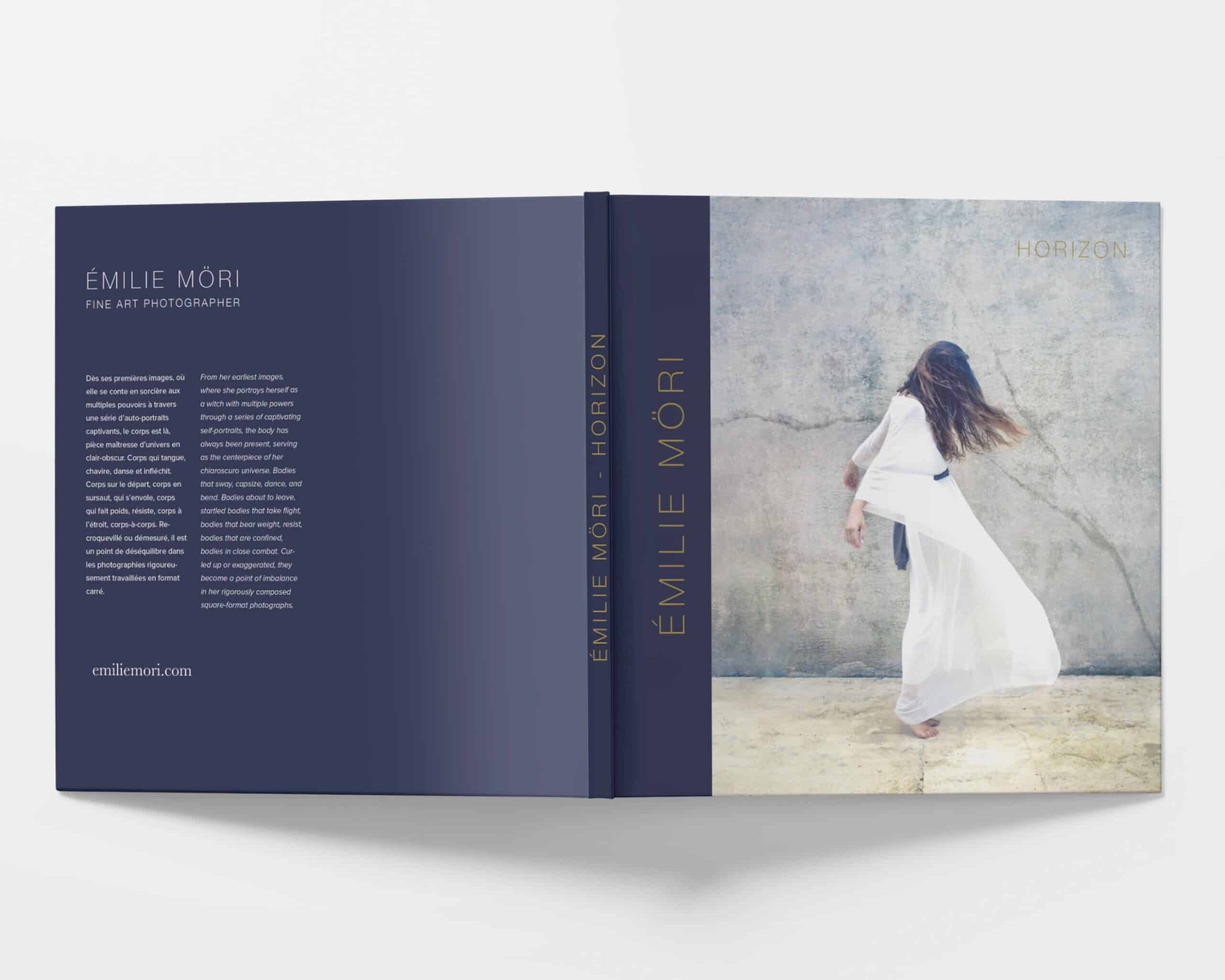 Front and back cover of Emilie Möri's new photo book, "Horizon" laying open on a white surface with the cover facing up.