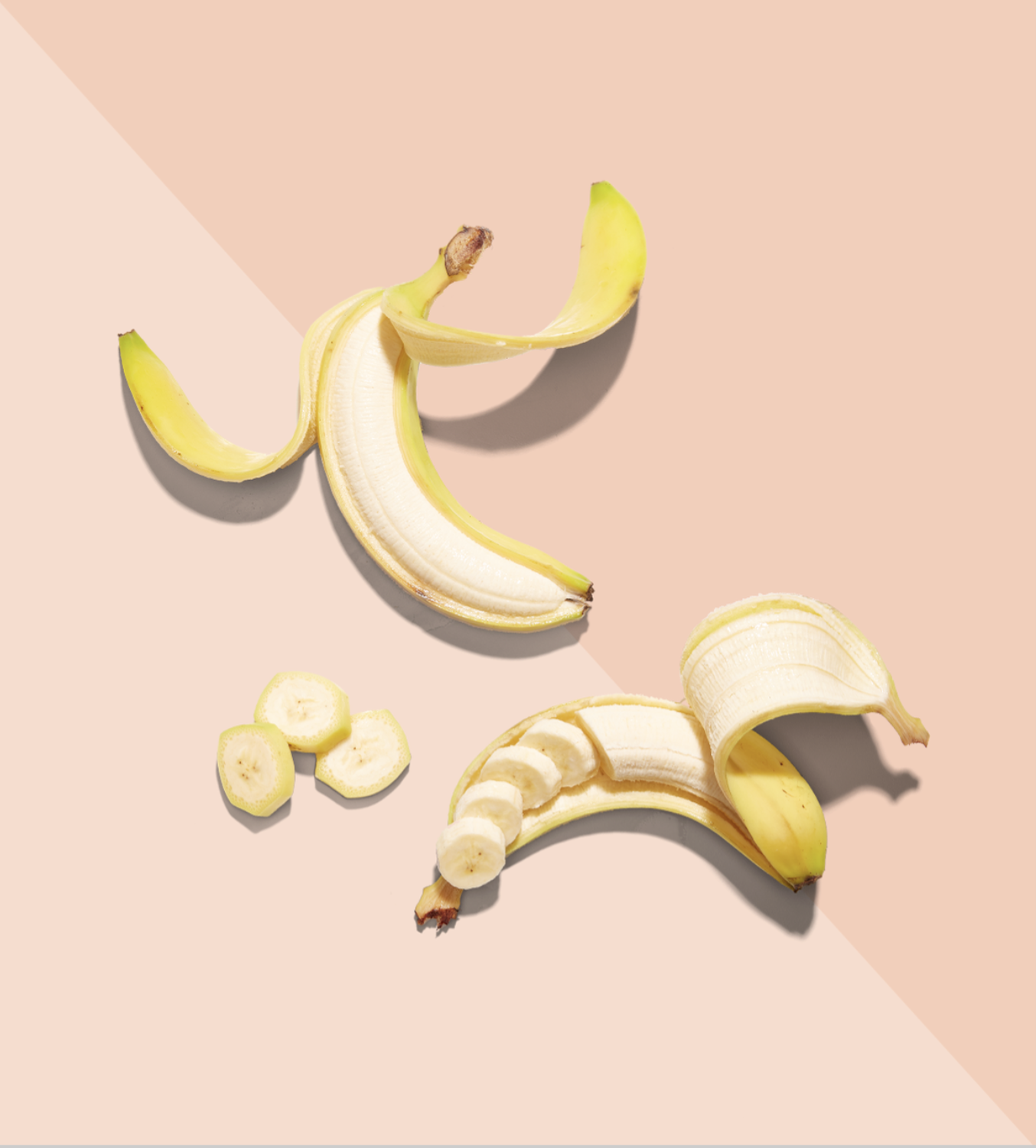 photo of partially peeled and sliced bananas on a pale pink surface by yasmin alishav