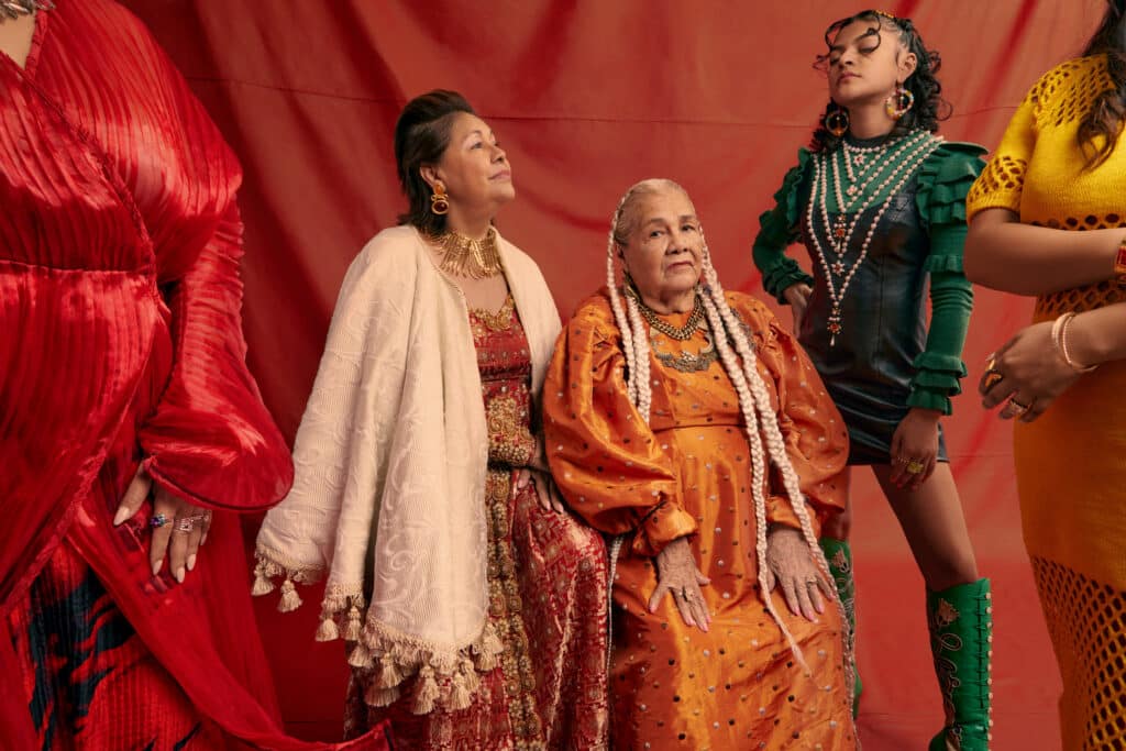 GENERACIONES, photograph showing five women from multiple generations in traditional Mexican and Indigenous inspired clothing and hair.