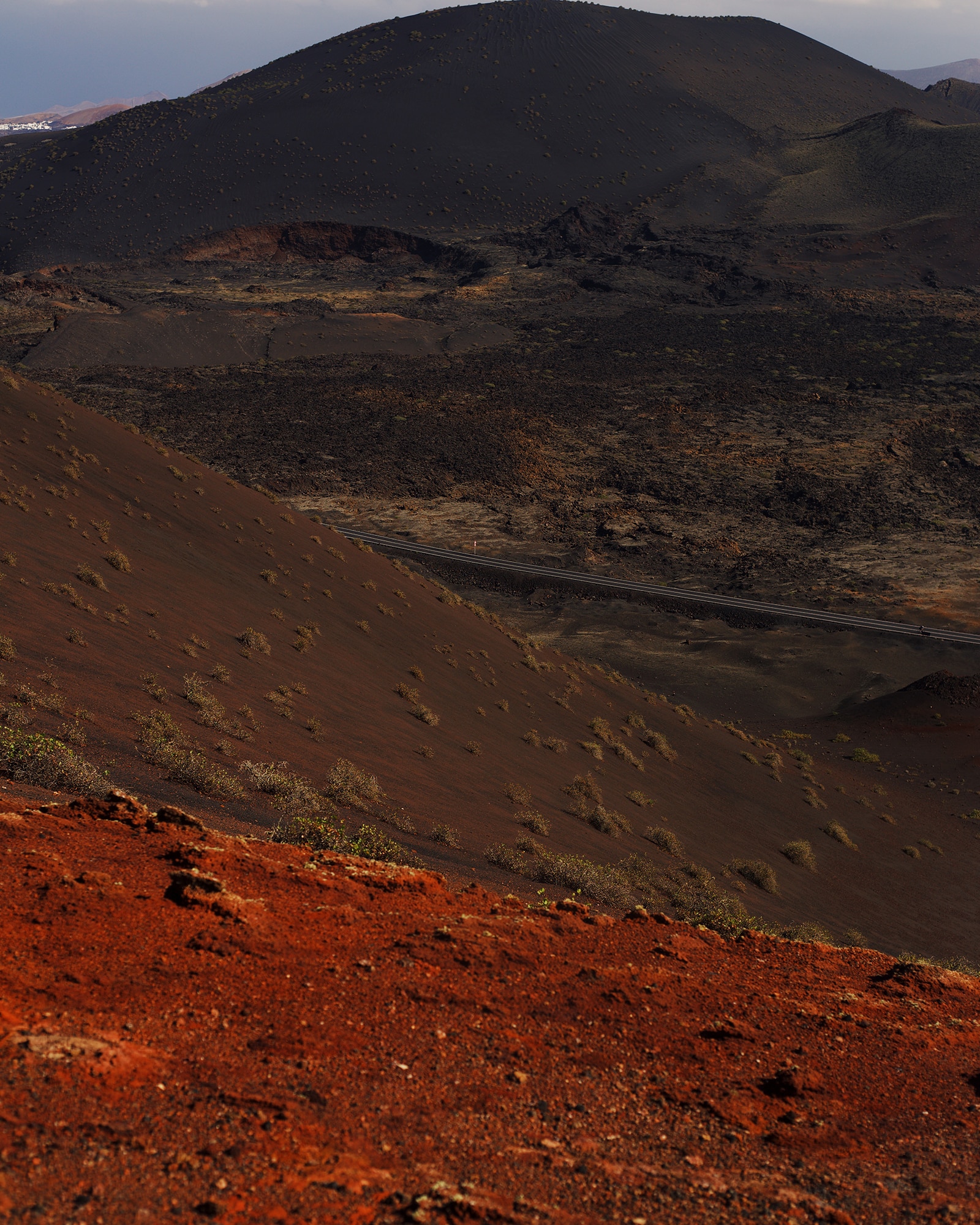 photograph of brown mountains and red valleys by Alice Angelini