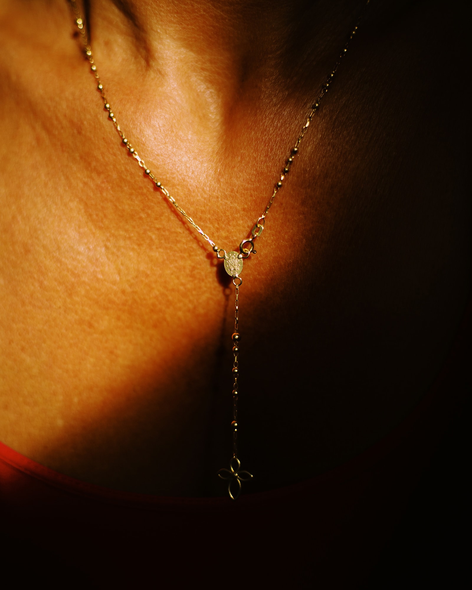 light on neck and chest with necklace by Alice Angelini