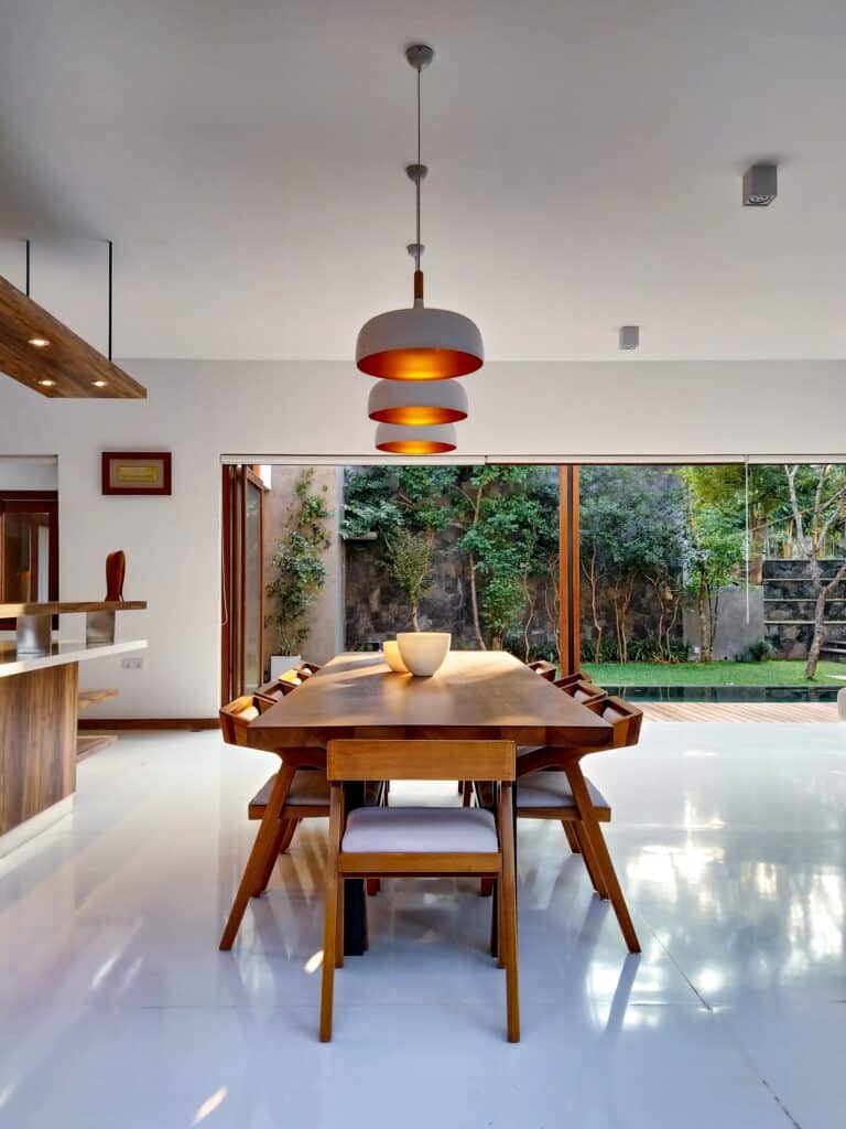 https://www.format.com/wp-content/uploads/Interior-dining-room-space-with-modern-furniture-and-warm-pendant-lights-768x1024.jpg