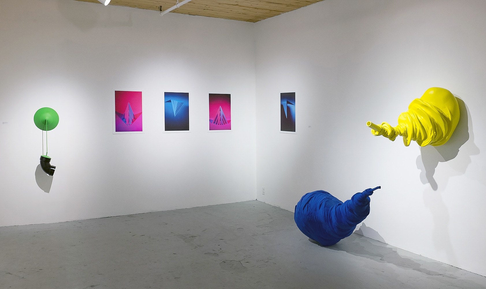 gallery with brighly colored installation art